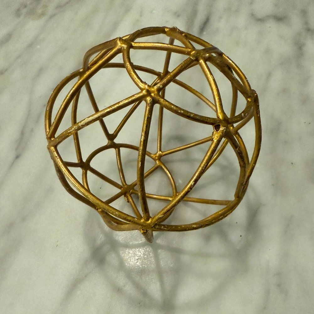 Gold round sculpture